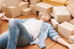Man stresses over moving a lot of boxes out of his old house